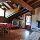 Sala de estar con cocina americana del apartamento Giglio dei Monti en Cogne